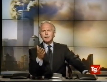 Guido Barendson conduce un’edizione straordinaria del TG2 dell’11 settembre 2001, con le immagini del World Trade Center sullo sfondo.